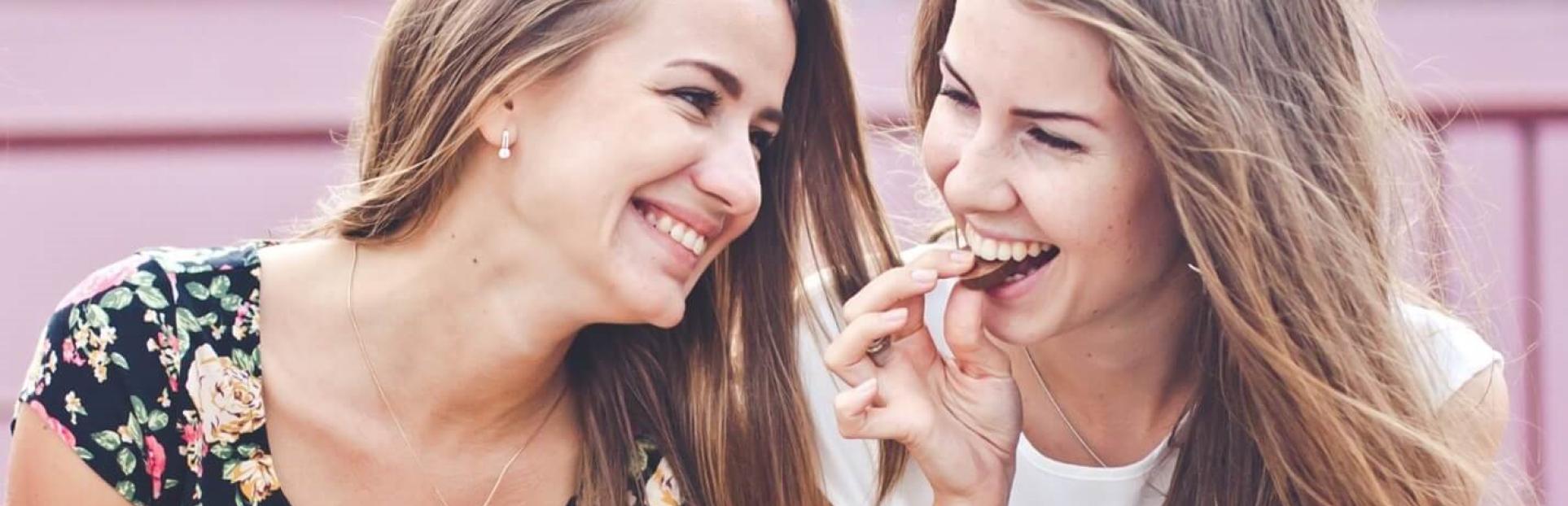 two girls snacking