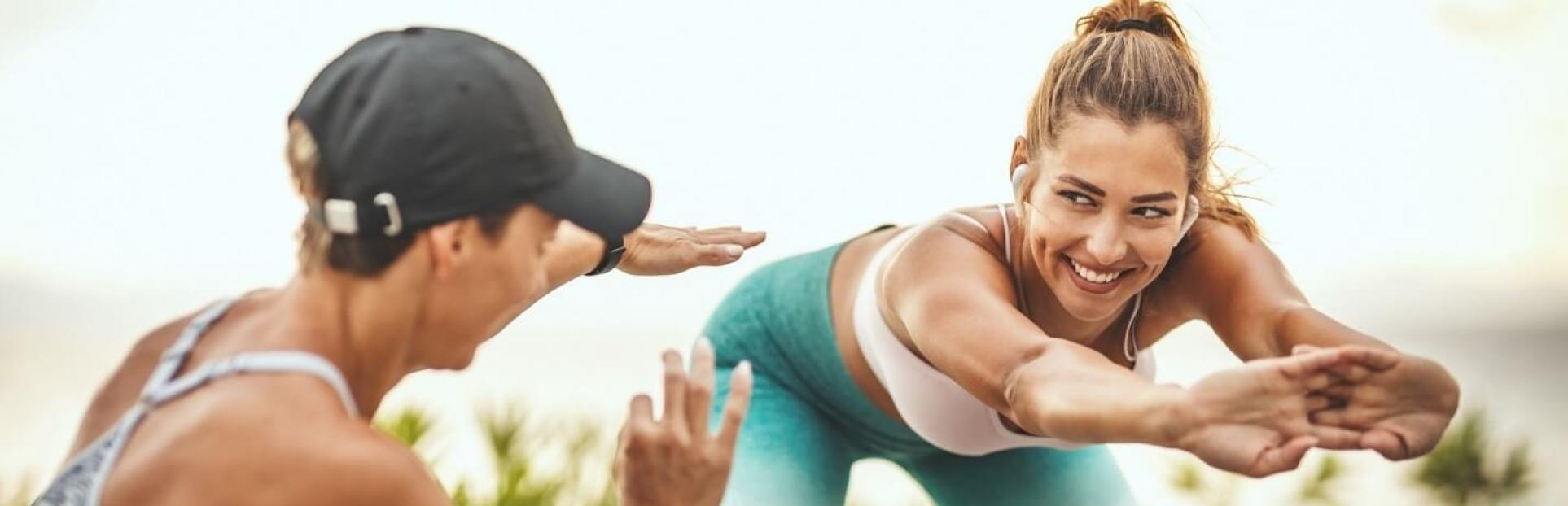 two women stretching