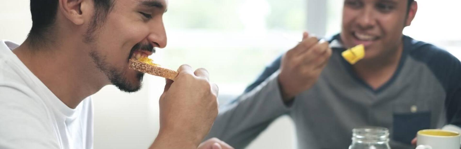 two men eating breakfast