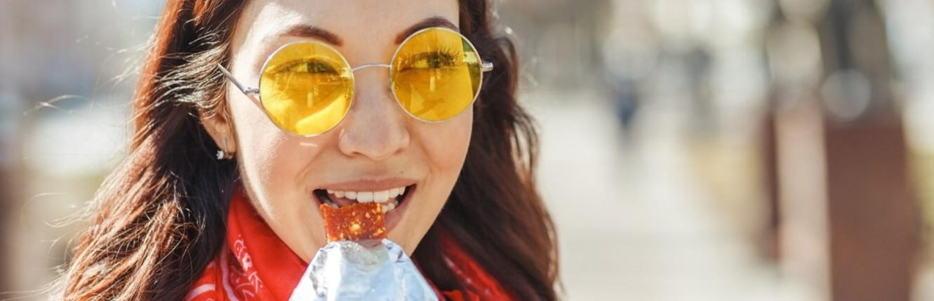 woman eating bar