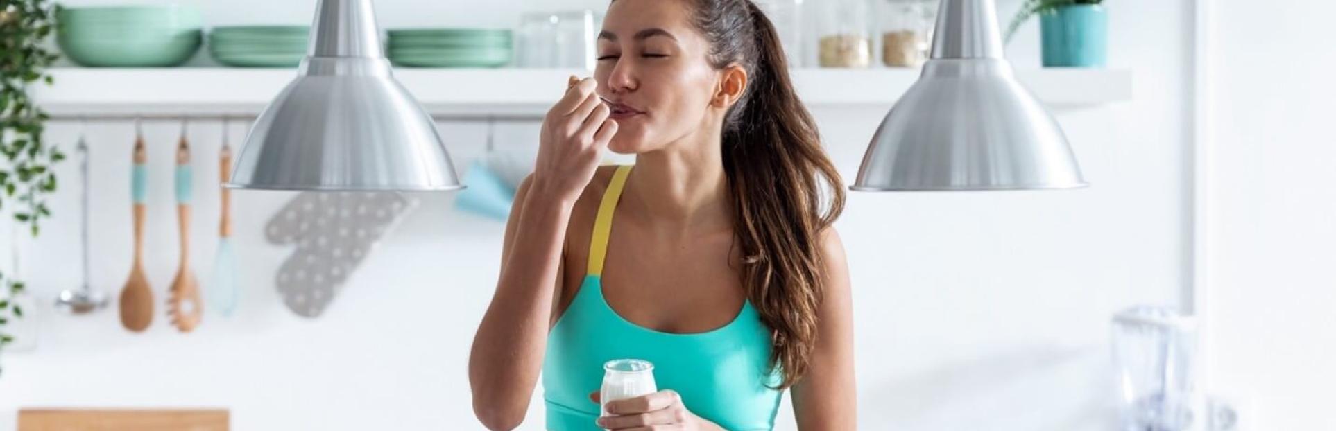 woman eating yogurt