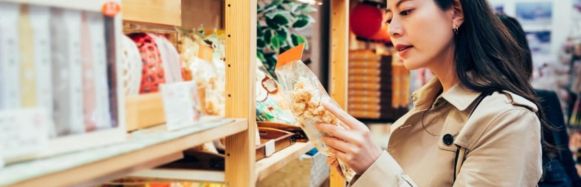 woman looking at food in market