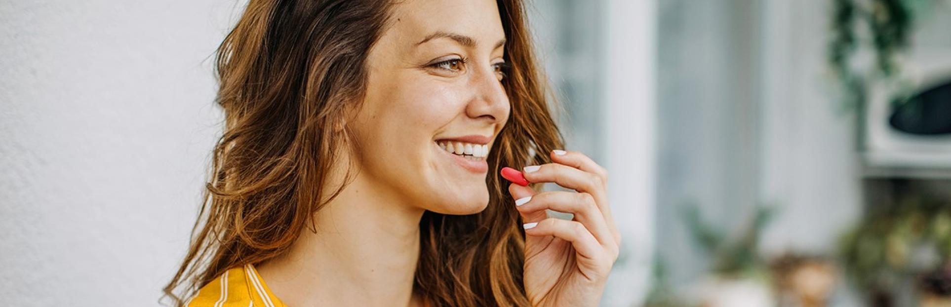 woman taking vitamin