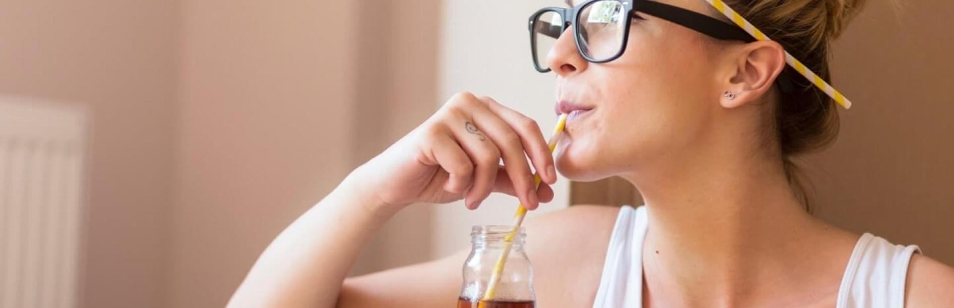 woman drinking beverage