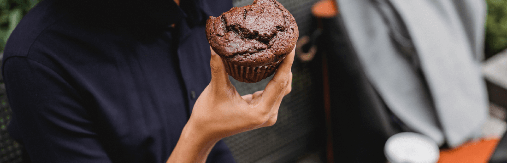 woman eating muffin