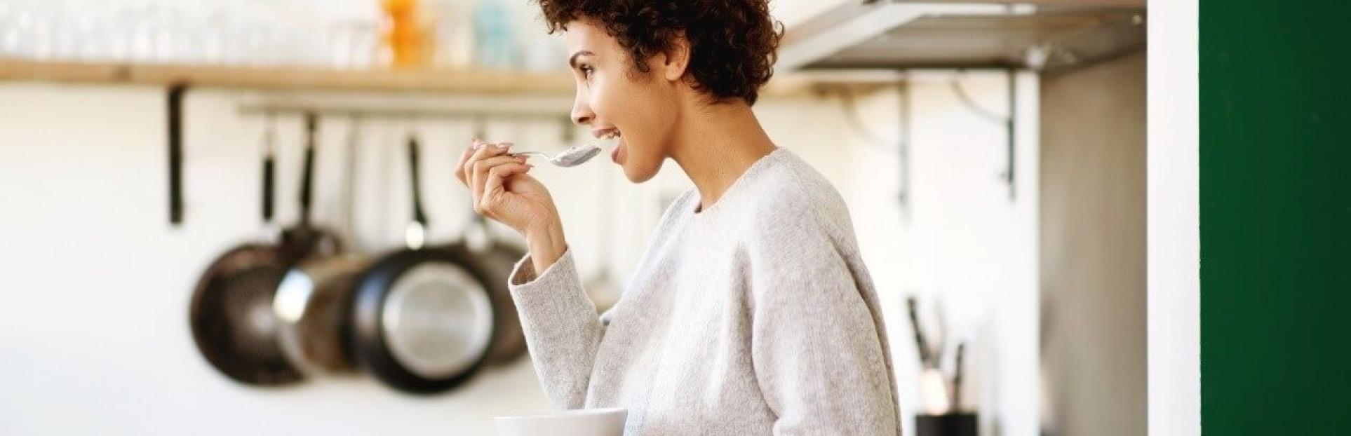 woman eating yogurt