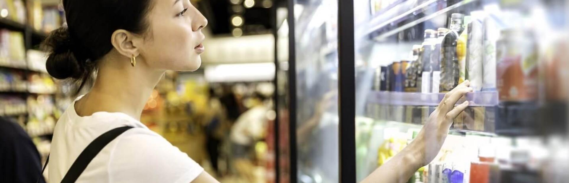 woman looking at beverages