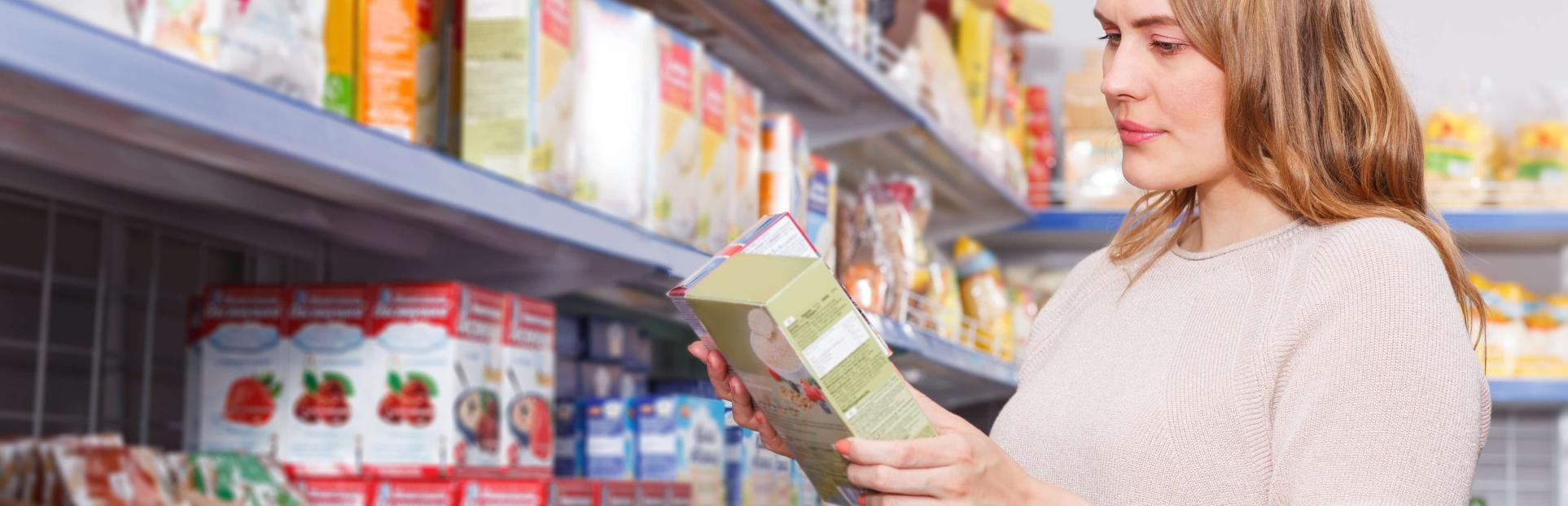 woman looking at cereal in store