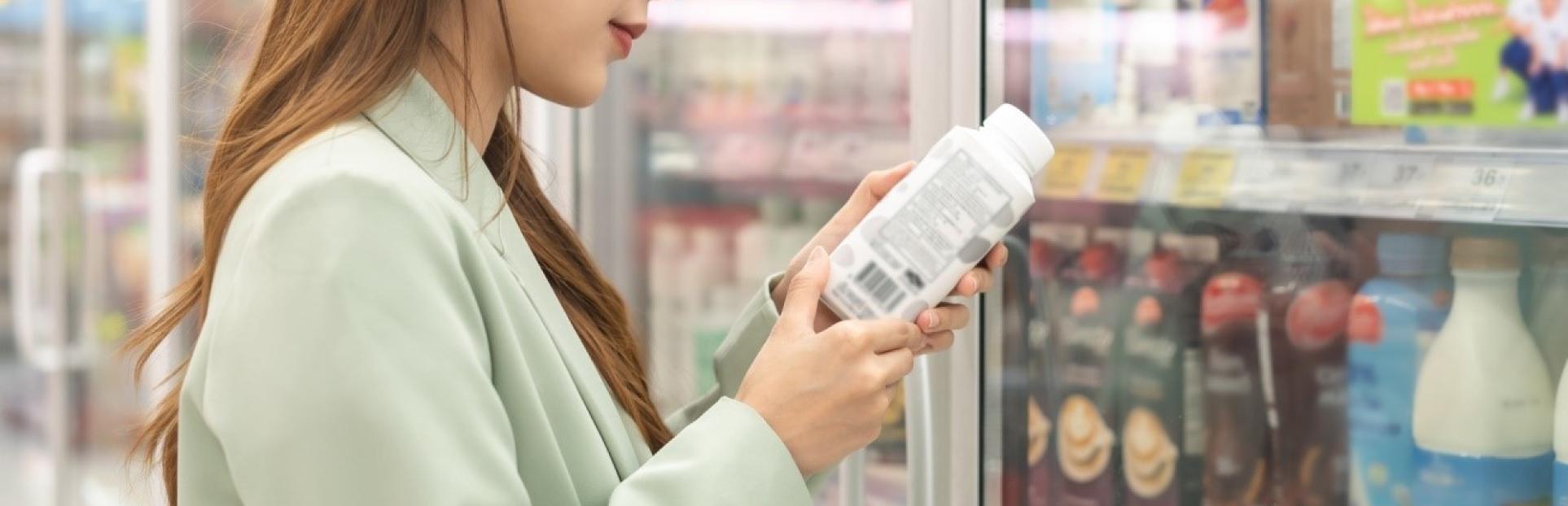 woman looking at drink