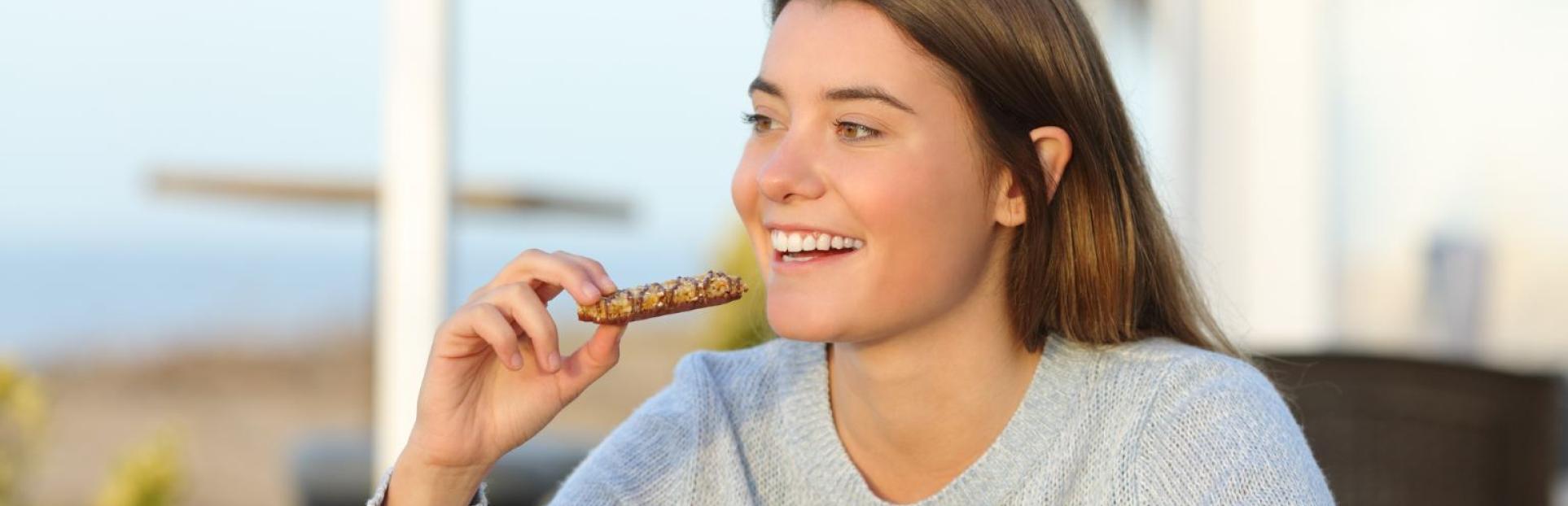 woman with nutritious bar