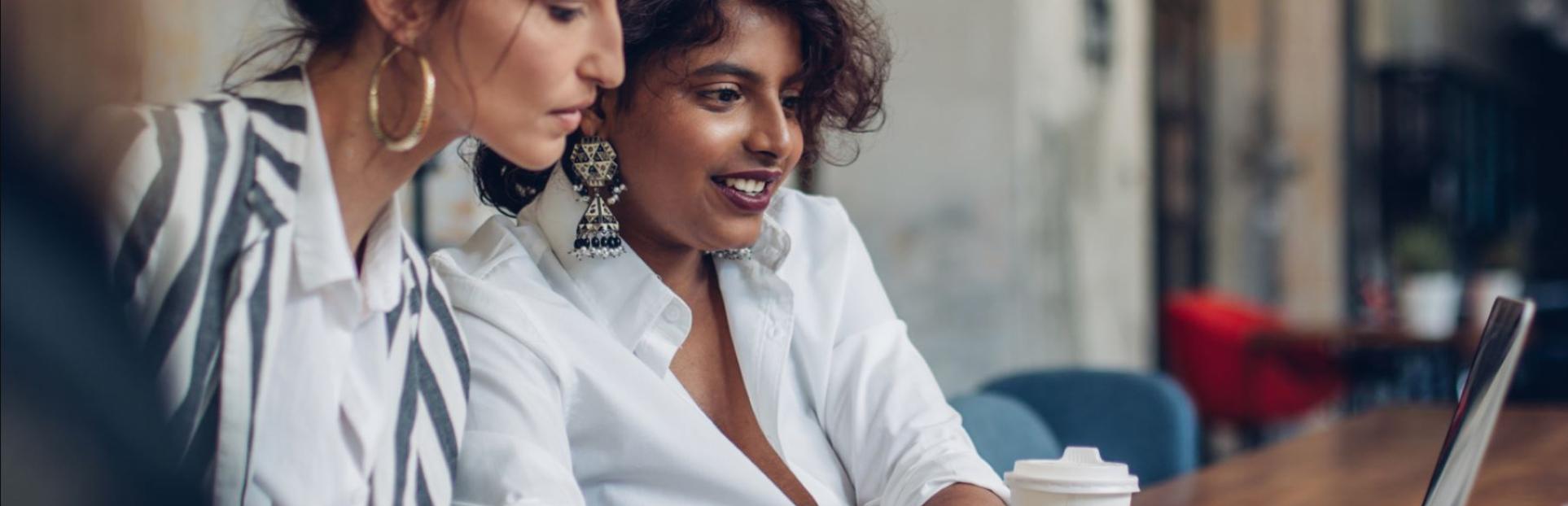 two women with a laptop