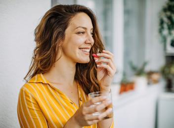 woman taking vitamin