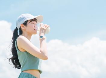 woman drinking beverage