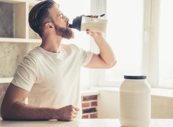 Man and Protein Powder Shaker