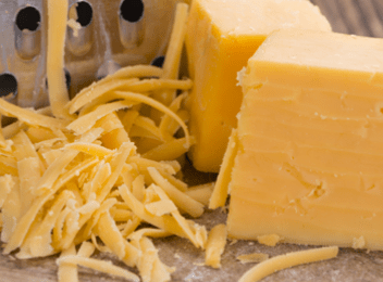 grated cheddar cheese and block of cheese