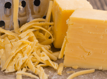 grated cheddar cheese and block of cheese