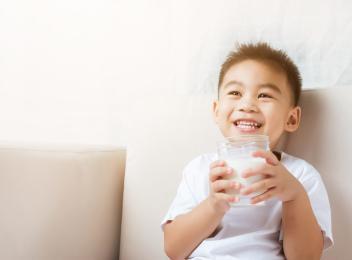 little boy with glass of milk