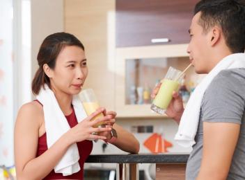 man and woman eating bar