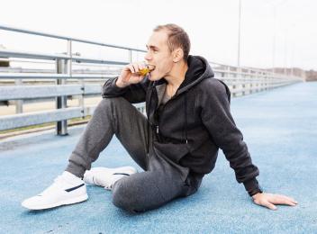 Man eating protein bar