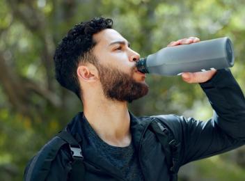 man drinking water