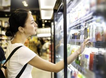 woman looking at beverages