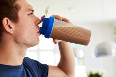 man with protein shake