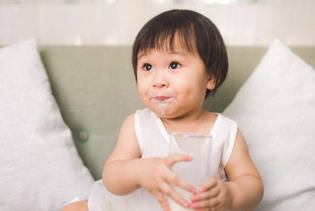 toddler with milk