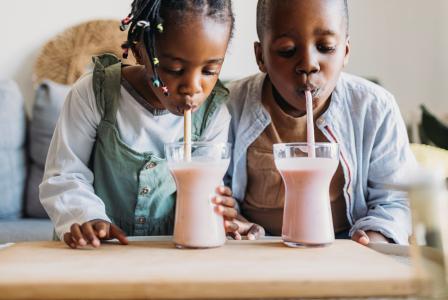 siblings drinking shake