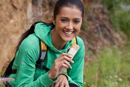 woman eating bar