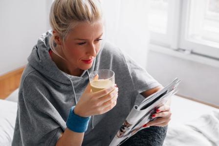woman drinking beverage