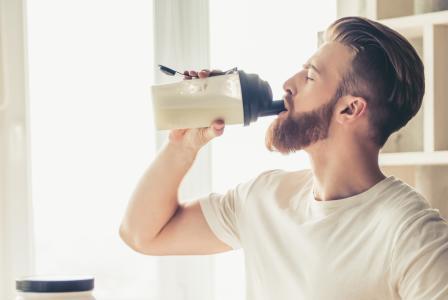man with protein shaker