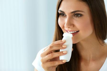 woman drinking yogurt 