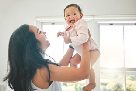 mom holding baby