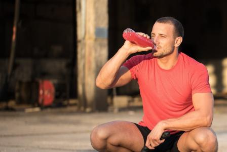 man drinking beverage