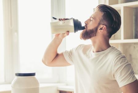 man drinking protein shake