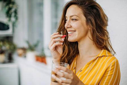 woman taking vitamin