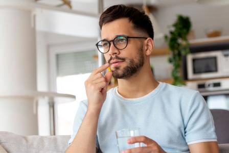 man taking pill