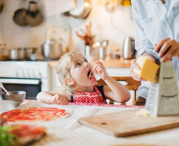 little girl eating cheese