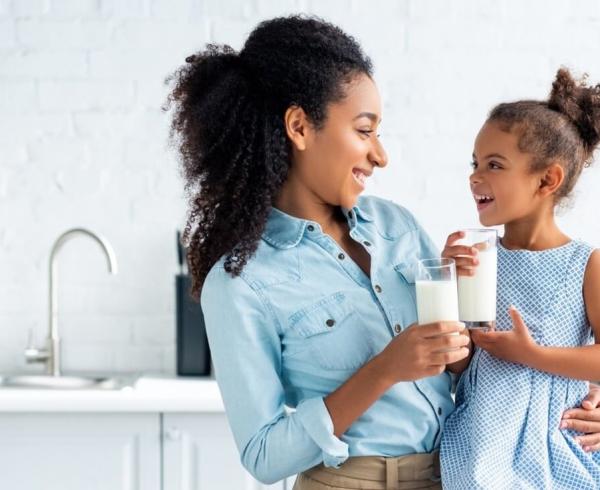 mom and daughter with milk