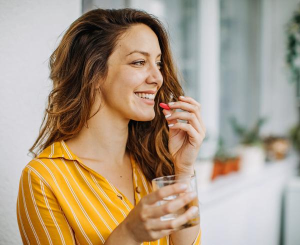 woman taking vitamin