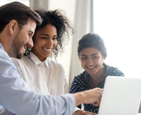 3 people at work looking at computer