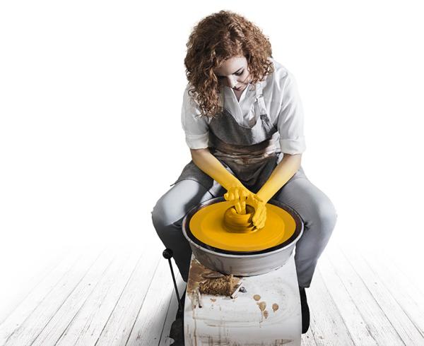 Lady making pottery