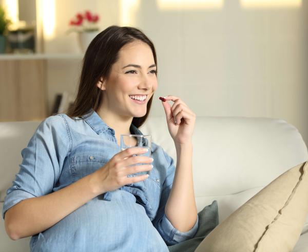 woman taking supplement