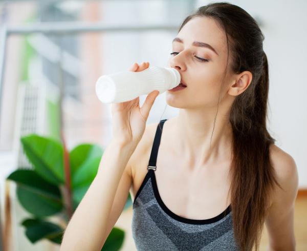 woman drinking beverage