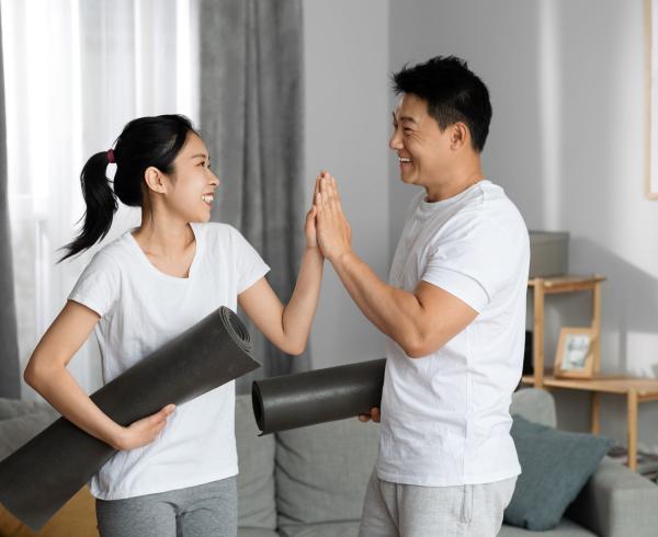 man and woman high fiving