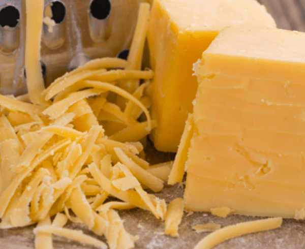 grated cheddar cheese and block of cheese