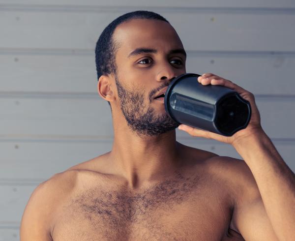 man drinking protein shake