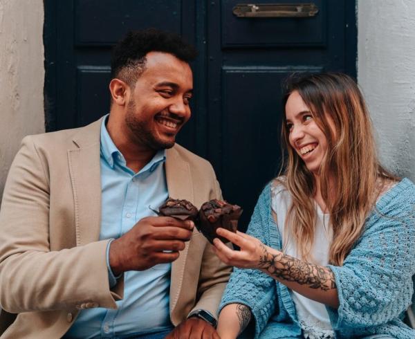 couple eating muffins