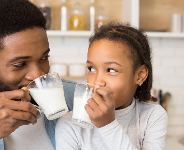 dad and daughter drinking milk