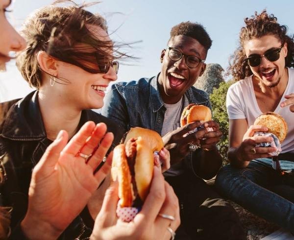 group of friends eating burger